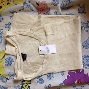 Plain cream colored shirt with pocket